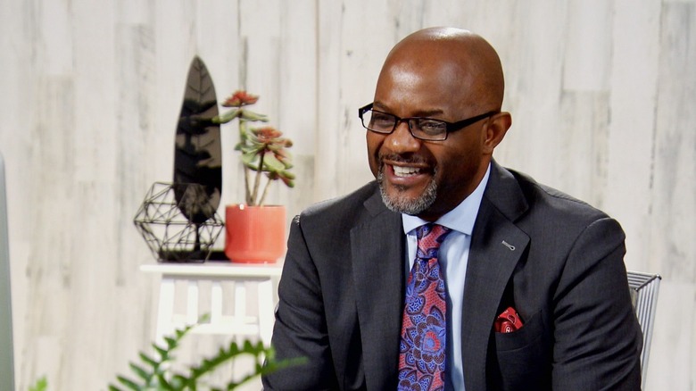 Pastor Cal Roberson smiling in his office