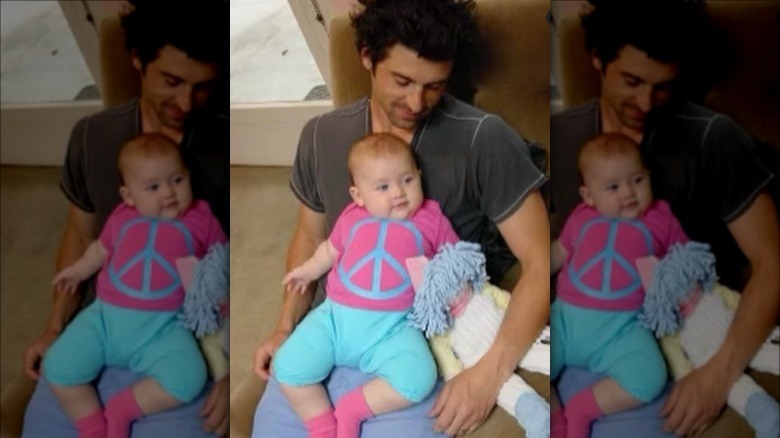 Patrick Dempsey holding baby Talula