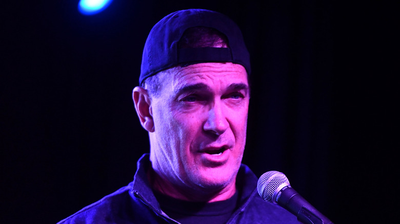 Patrick Warburton talking into a microphone