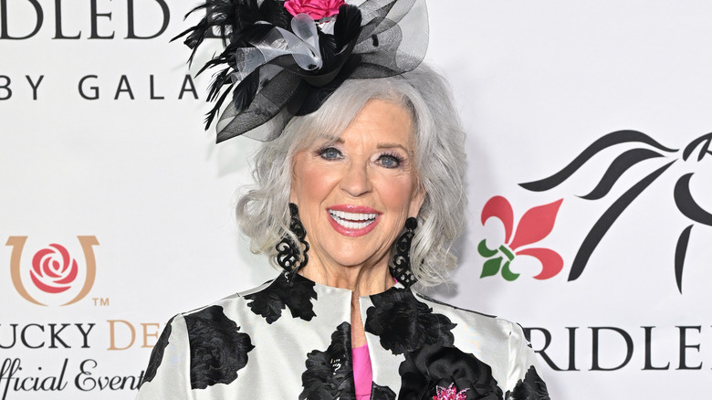Paula Deen smiling at an event in 2024