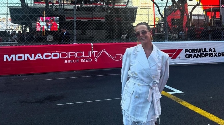 Pauline Ducruet smiles in white at the Formula 2 Grand Prix race in Monte-Carlo.