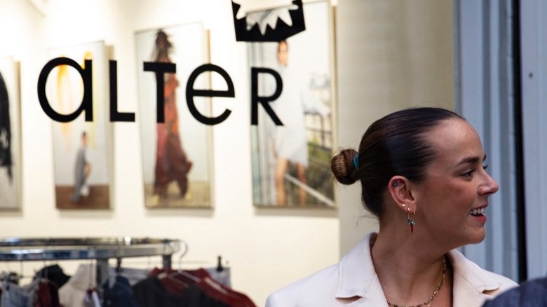 Pauline Ducruet turns her head to the side standing outside of her store, Alter.