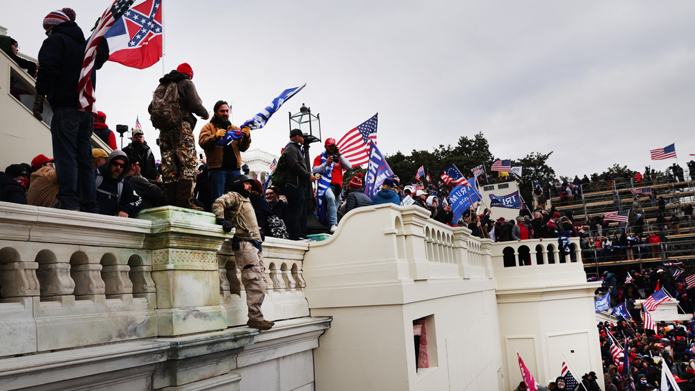 Rioters attacking the Capitol