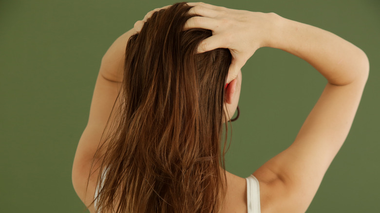 Woman massaging scalp