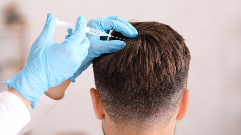 Man receiving scalp injection