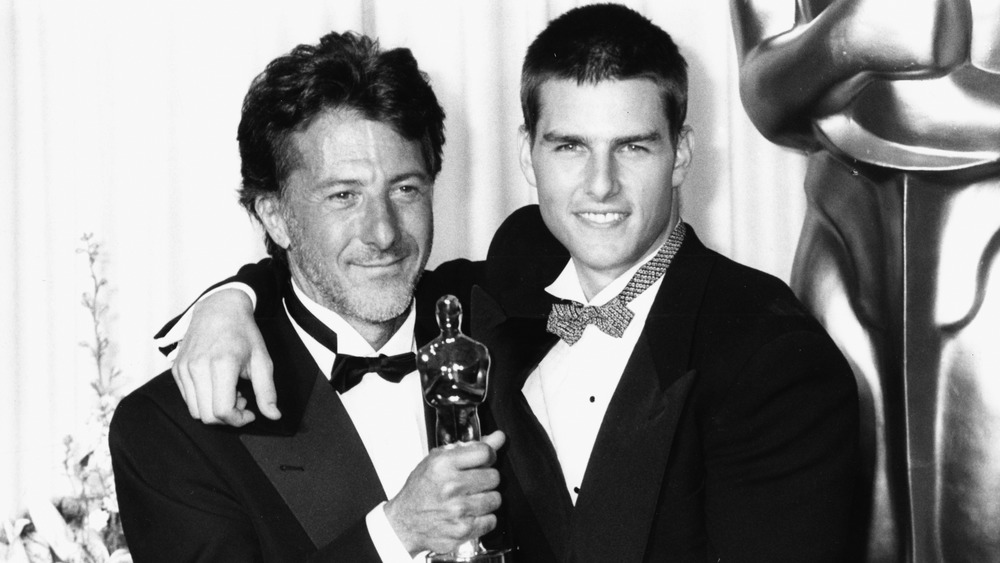 Tom Cruise and Dustin Hoffman holding an Oscar