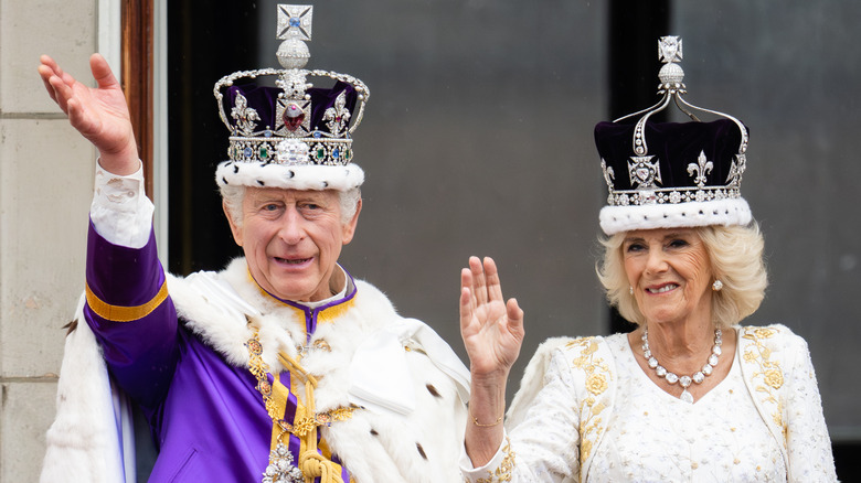 King Charles III and Queen Camilla waving