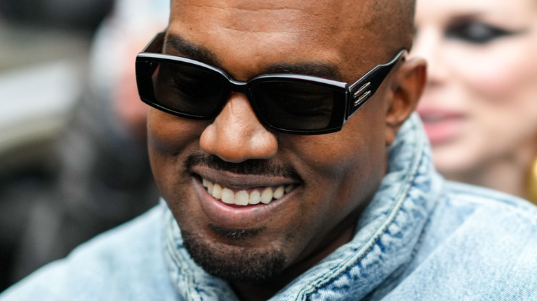 Ye smiles wearing sunglasses