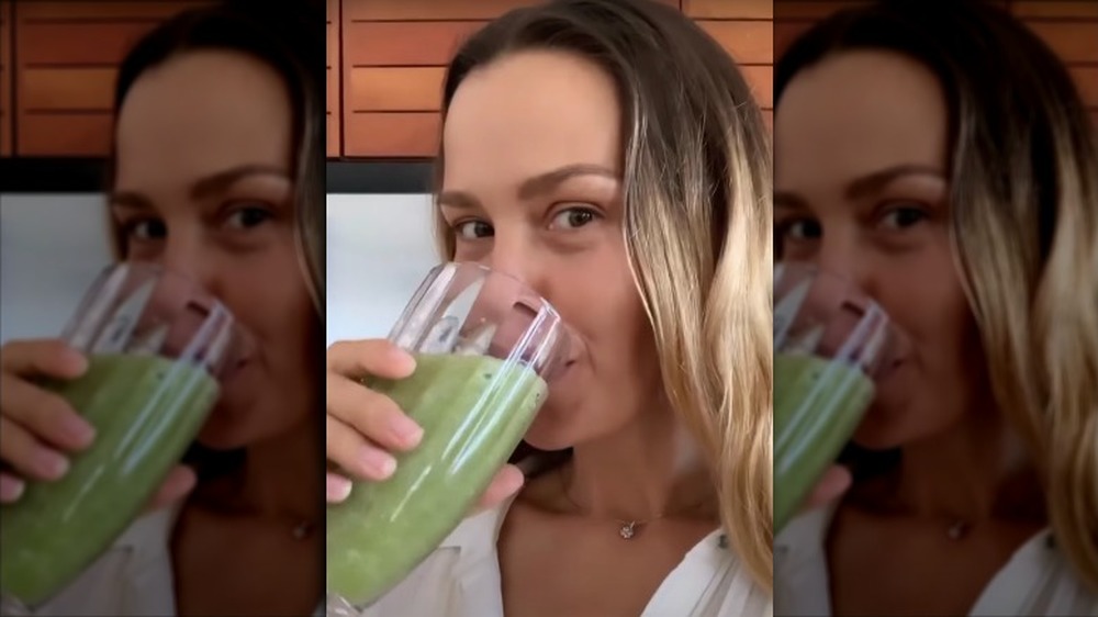 Petra Nemcova drinking a green smoothie 