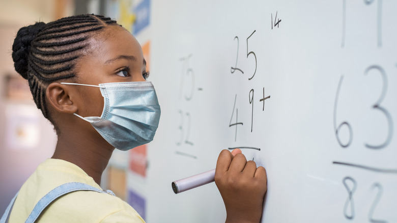 masked girl in school