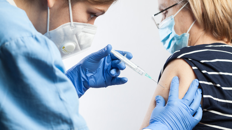 Healthcare professional administering a vaccine