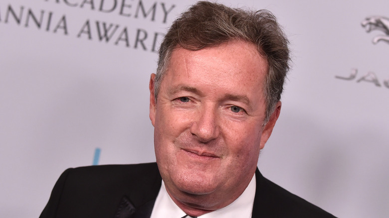 Piers Morgan posing on red carpet