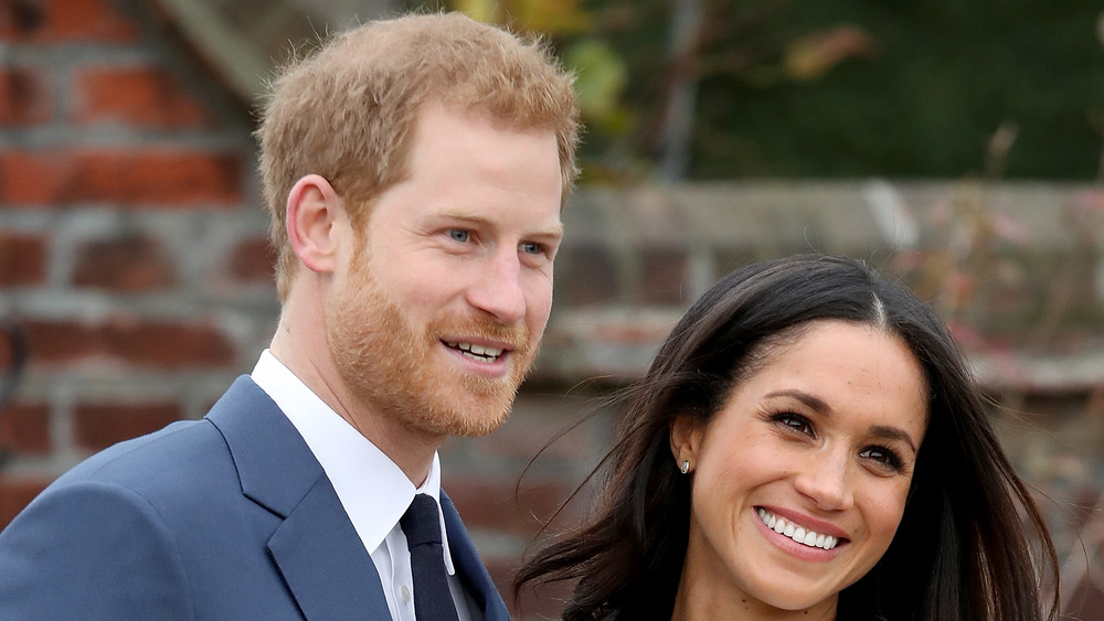 Harry and Meghan pose for photos