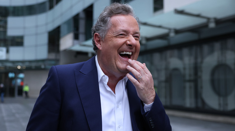 Piers Morgan laughing departing BBC Broadcasting House 