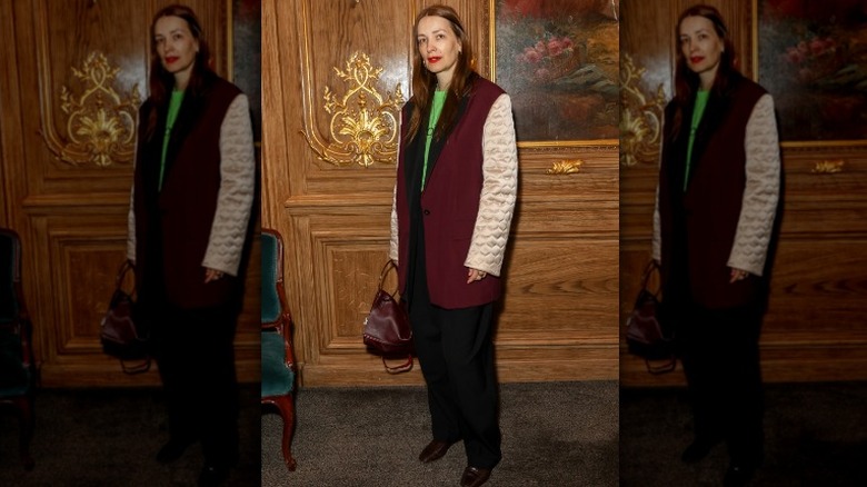 woman in maroon and pink jacket