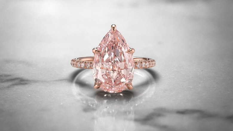 Pear-shaped pink diamond ring in platinum with white diamonds. | Tiffany &  Co.