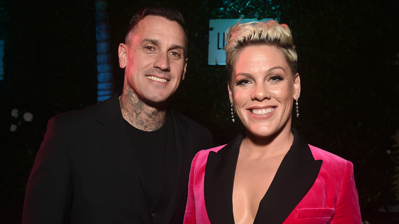 Carey Hart and Pink posing together