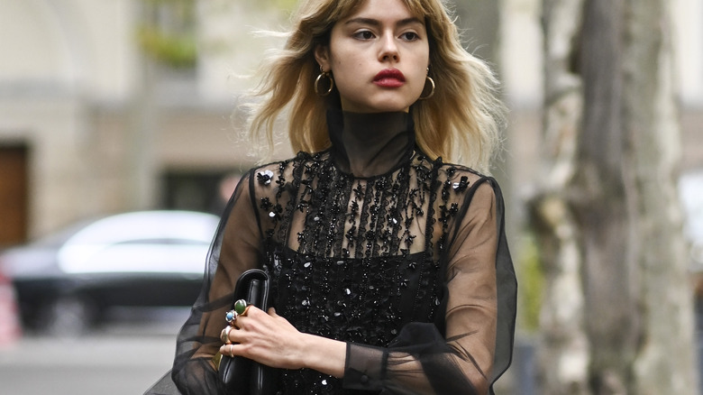 woman wearing sheer black top