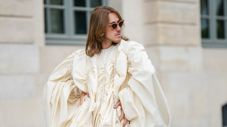 man wearing ruffled top