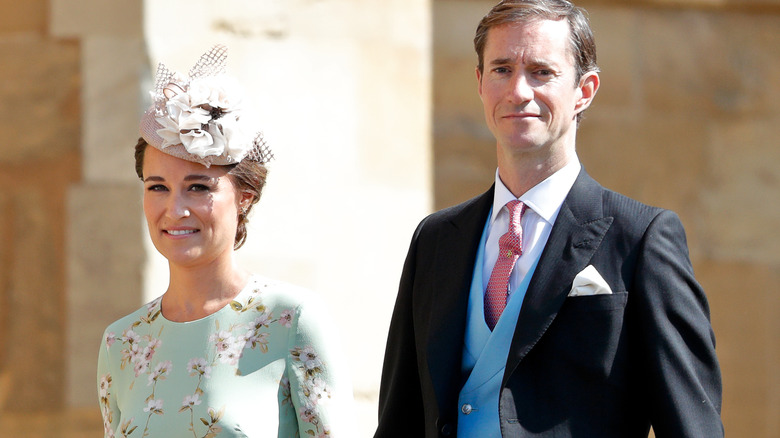 Pippa Middleton and James Matthews attending a wedding in their finery