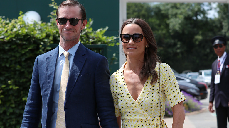 Pippa Middleton and James Matthews wearing sunglasses as they take a walk