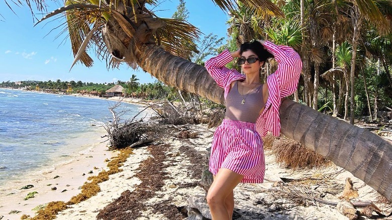 Woman wearing pink and white striped short set