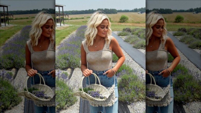 Woman in jeans standing in a lavender field