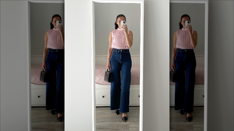 pink pleated top with flare jeans