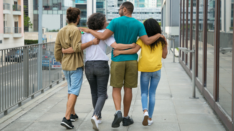 Two men and two women walking