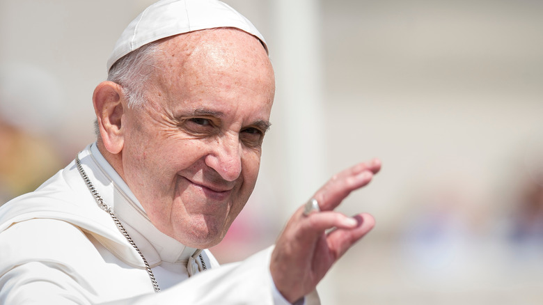 Pope Francis smiling and waving 