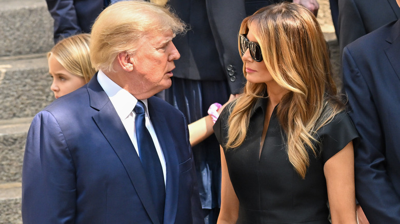 Donald talking with Melania outdoors