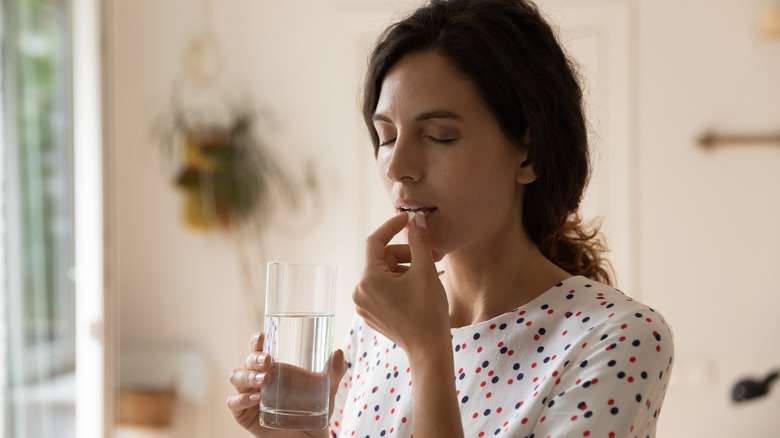 woman taking medication