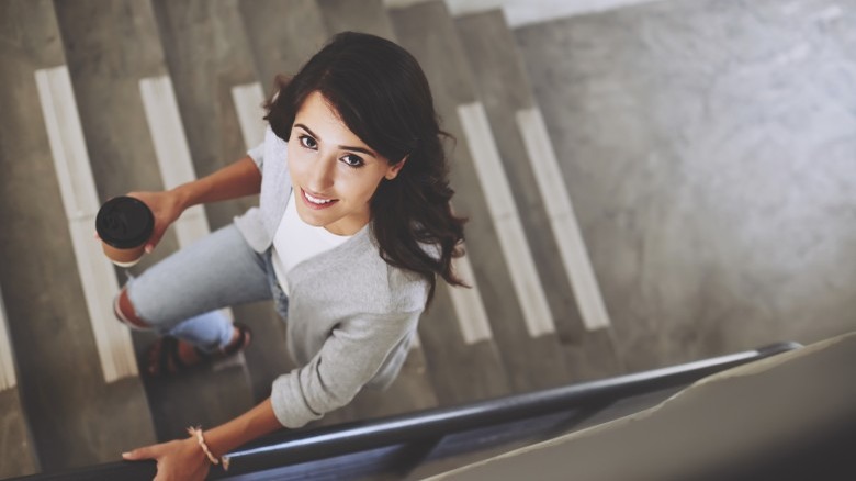 woman walking up the stairs