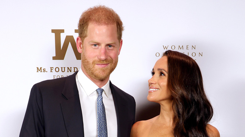 Meghan Markle smiling at Prince Harry