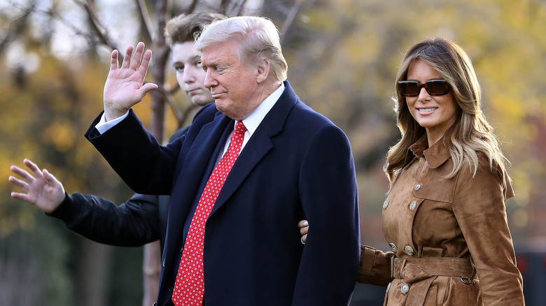 Barron, Donald, and Melania Trump walking together