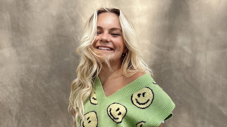 Pressley Hosbach wearing smiley face sweater