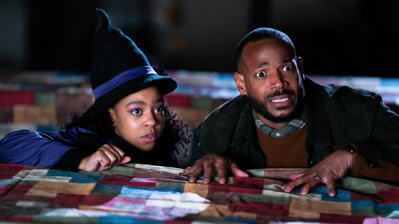 Priah Ferguson and Marlon Wayans looking scared in The Curse of Bridge Hollow