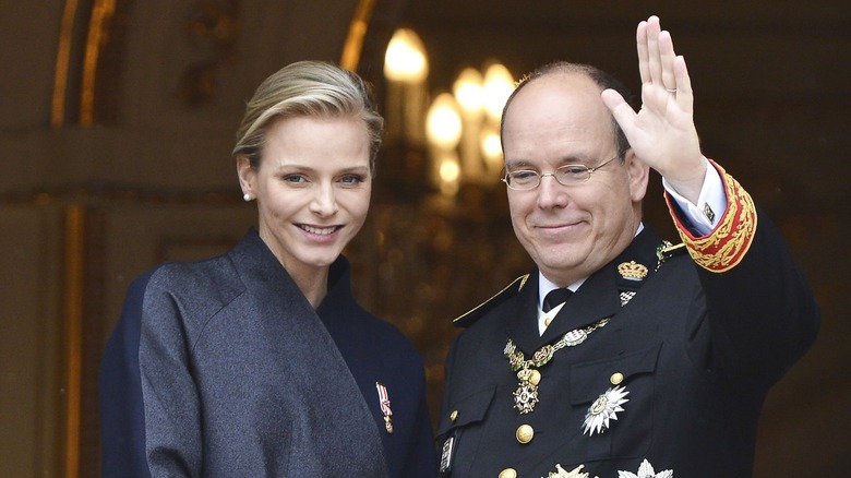 Princess Charlene and Prince Albert II waving