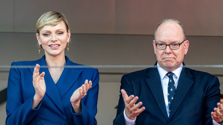 Princess Charlene and Prince Albert clapping