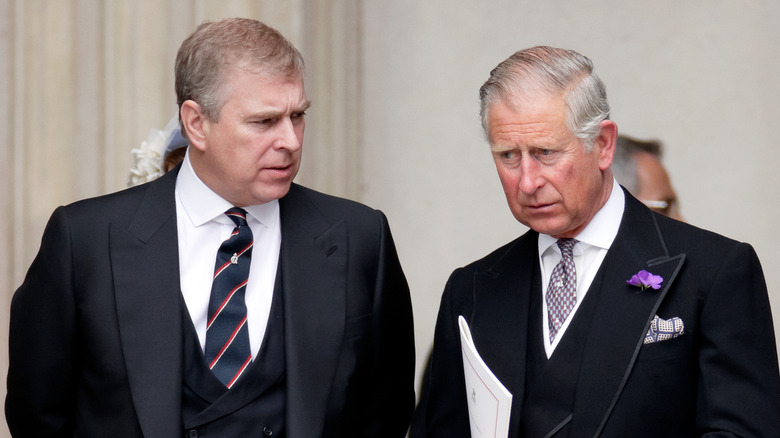 Prince Andrew speaking to King Charles