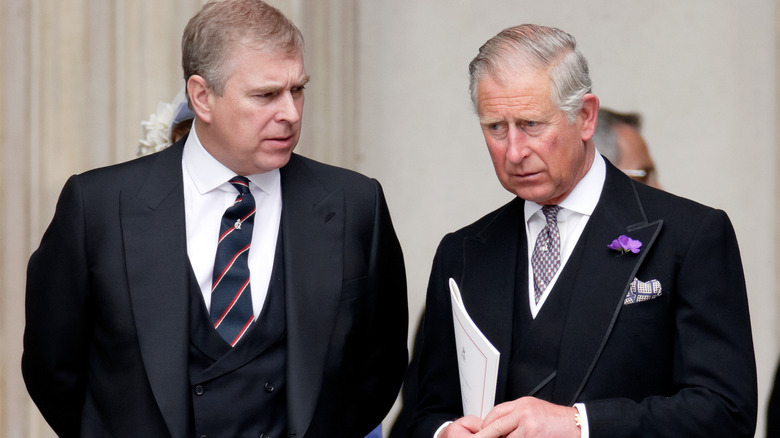 Prince Andrew speaking with King Charles III