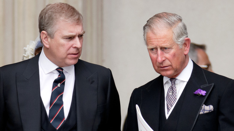 Prince andrew and king charles facing each other