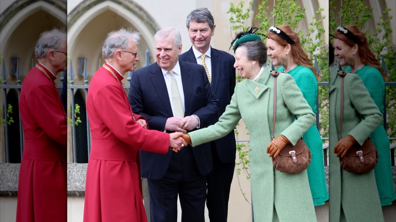 Princess Anne shaking hands with Vice Admiral Sir Timothy Laurence with Prince Andrew