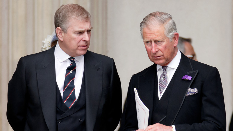 Prince Charles and Prince Andrew  talking