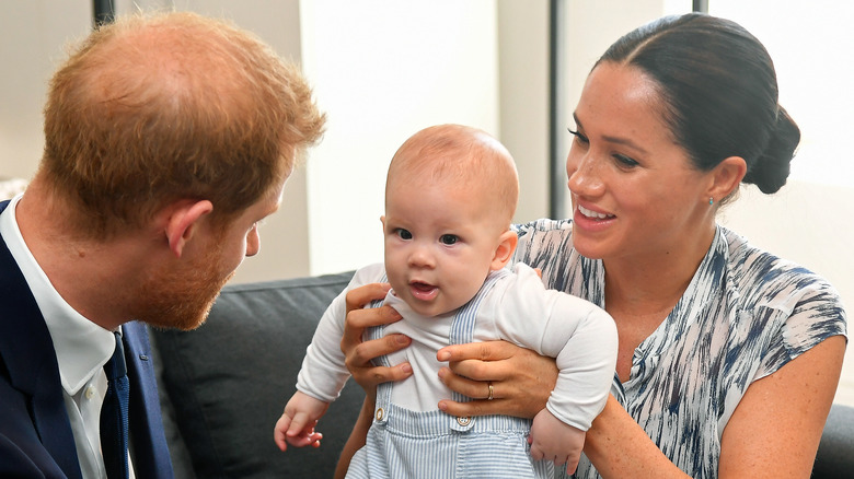 Prince Harry and Meghan Markle hold Prince Archie