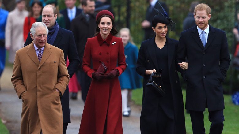 Prince Charles, Prince William, Kate Middleton, Meghan Markle and Prince Harry walking together outside