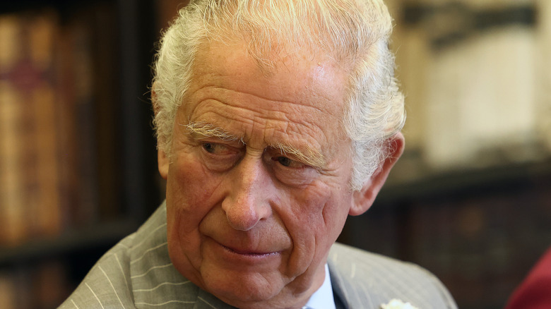 Prince Charles looking at someone