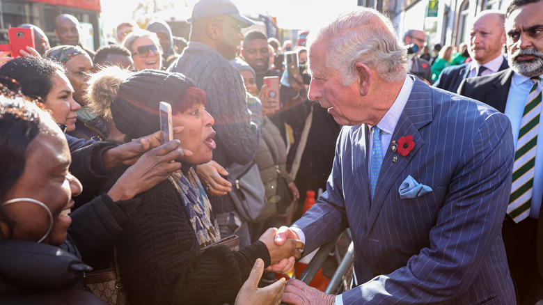 Prince Charles greets fans. 