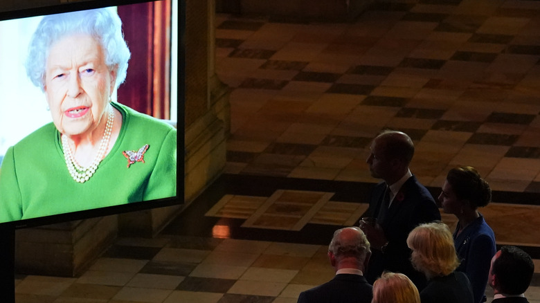 Queen Elizabeth delivering video message on screen at COP26