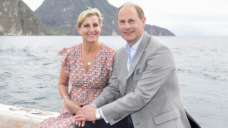 Prince Edward and Duchess Sophie smiling against sea